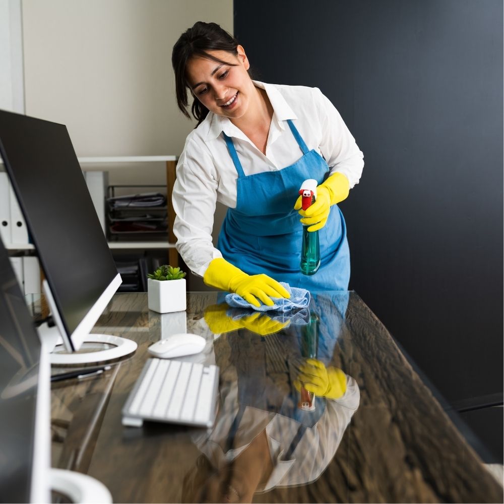 Professional office cleaning service in Sun Valley NV – cleaner sanitizing desks and workspaces